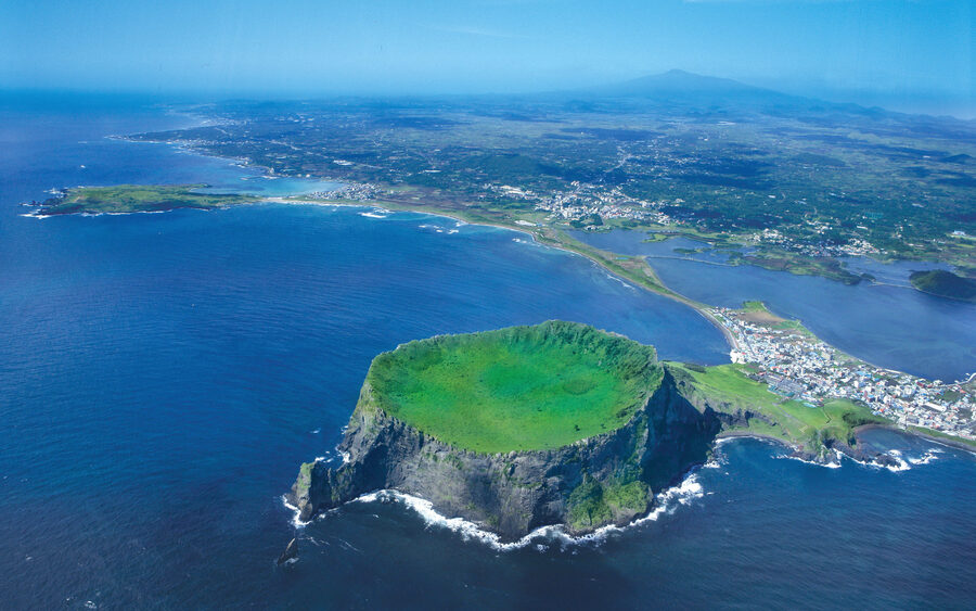 Aerial view of Seongsan Ilchulbong tuff cone, part of Jeju's UNESCO World Natural Heritage.